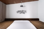 Arapaho property bedroom with built-in projector and modern decor