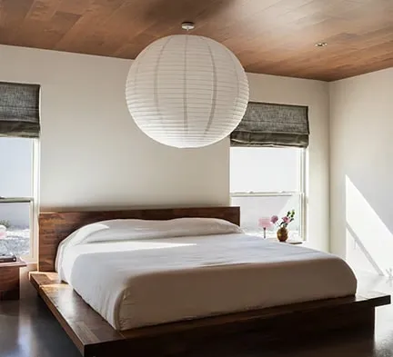 Arapaho property elegant bedroom with cozy bed and warm lighting