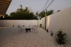 Arapaho property outdoor firepit area with chairs and desert landscaping